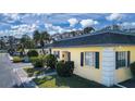 Aerial view of a yellow house and surrounding buildings at 2413 Aspinwall St # 2413, Sarasota, FL 34237