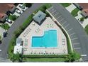 Aerial view of community pool with lounge chairs and ample parking at 2608 Edgewater Ct, Palmetto, FL 34221