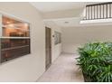 Condo entryway with tiled floor and potted plant at 3240 Gulf Of Mexico Dr # B104, Longboat Key, FL 34228