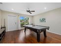 Pool table in a well-lit game room with hardwood floors at 330 Caruso Pl, Sarasota, FL 34237