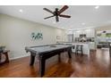 Game room features a pool table and hardwood floors at 330 Caruso Pl, Sarasota, FL 34237