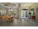 Spacious dining area with wood table and large windows at 3395 Hardee Dr, Venice, FL 34292