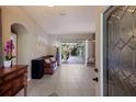 Bright and airy entryway with tile floors and access to backyard at 3395 Hardee Dr, Venice, FL 34292