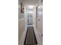 Bright hallway with marble floors and access to multiple rooms at 3951 Lake Bayshore Dr # F408, Bradenton, FL 34205