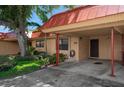 Condo exterior showcasing carport and landscaping at 4108 La Costa Cv, Bradenton, FL 34210