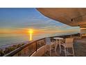 Breathtaking sunset view from a condo balcony overlooking the ocean at 415 L Ambiance Dr # A401, Longboat Key, FL 34228