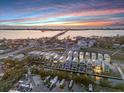 Aerial view of waterfront townhomes at sunset at 4238 Marina View Way, Cortez, FL 34215