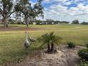 View of the golf course with birds in foreground at 452 Cerromar Rd # 176, Venice, FL 34293