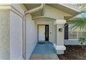 Front entrance with a white door and arched entryway at 4822 30Th Street E Ct, Bradenton, FL 34203