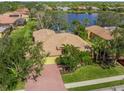 Bird's-eye view of single-Gathering home with driveway and yard at 4850 Sweetshade Dr, Sarasota, FL 34241