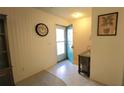 Bright entryway with teal door and tiled floor at 5940 7Th W Ave # 5940, Bradenton, FL 34209