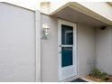 Condo entrance with light fixture and address number at 5940 7Th W Ave # 5940, Bradenton, FL 34209