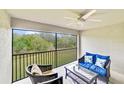 Relaxing screened porch with seating and nature views at 6705 Grand Estuary Trl # 201, Bradenton, FL 34212