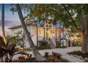Stunning waterfront home with landscaped grounds at 6821 Longboat S Dr, Longboat Key, FL 34228