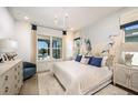 Spacious bedroom with water view, large bed, and coastal decor at 719 Maldives Trl, Sarasota, FL 34234