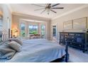 Bright and airy main bedroom with a king-size bed, large windows, and a walk-in closet at 7503 Calle Facil, Sarasota, FL 34238