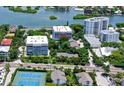 Aerial view of the condo building and its location near the water at 1255 E Peppertree Dr # 402, Sarasota, FL 34242