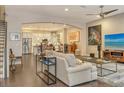 Open living space with hardwood floors, comfortable seating, and a large TV at 1273 Boulevard Of The Arts, Sarasota, FL 34236