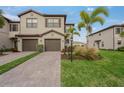 Two-story townhome with attractive landscaping and two-car garage at 15147 Lyla Ter, Bradenton, FL 34211