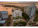 Aerial view of waterfront property, showcasing building and surroundings at 166 Golden Gate Pt # 21, Sarasota, FL 34236