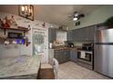 Cozy kitchen with stainless steel appliances and gray cabinets at 2206 25Th W Ave, Bradenton, FL 34205