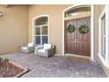 Welcoming entryway with double doors and comfortable seating at 2232 Elcid Ct, Palm Harbor, FL 34683