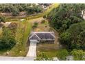 Housetop view showing the house, driveway, and surrounding landscape at 2415 Nowatney Ave, North Port, FL 34286