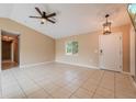 Spacious living room featuring tile floors and a neutral color palette at 2415 Nowatney Ave, North Port, FL 34286