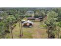 Aerial view of a house with a large fenced yard, perfect for horses at 3340 Ulman Ave, North Port, FL 34286