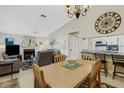 Light and airy dining room with view of living room and fireplace at 3815 59Th W Ave # 3815, Bradenton, FL 34210