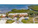 Aerial view of townhomes featuring private driveways and waterfront location at 4009 Catalina Dr # 178, Bradenton, FL 34210