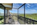 Enjoy water views from this cozy balcony with railings and chair at 4009 Catalina Dr # 178, Bradenton, FL 34210