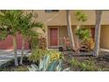 Townhouse entrance with landscaping and red door at 4009 Catalina Dr # 178, Bradenton, FL 34210