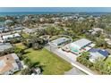 Aerial view of a single-Gathering home with a pool, and nearby ocean at 401 Shore Rd, Nokomis, FL 34275