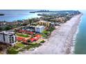 Beachfront property view, showing homes, beach, and ocean at 4239 Gulf Of Mexico Dr # Mh4, Longboat Key, FL 34228