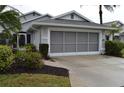 Gray house with a gray garage door at 4527 Fern Dr # 26, Bradenton, FL 34208