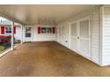 Covered carport with storage space and light-colored flooring at 4714 Potomac Cir, Bradenton, FL 34210