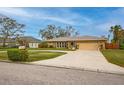 House with a circular driveway and nicely landscaped yard at 7510 16Th Nw Ave, Bradenton, FL 34209