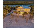 Waterfront home with private pool and lush landscaping at 777 N Manasota Key Rd, Englewood, FL 34223