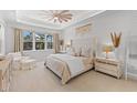 Spacious main bedroom with a king-size bed and plenty of natural light at 883 Seascape Pl, Sarasota, FL 34240