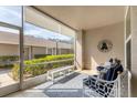 Relaxing condo screened patio with seating at 8901 Veranda Way # 116, Sarasota, FL 34238