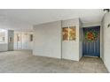 Condo entry with blue door and tile floor at 1000 Riverside Dr # B103, Palmetto, FL 34221