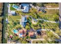 Bird's-eye view showcasing expansive property with pool and multiple buildings at 10106 46Th W Ave, Bradenton, FL 34210