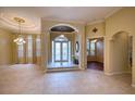 Spacious living room with high ceilings and a tile floor at 10523 Cheval Pl, Lakewood Ranch, FL 34202