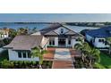 Luxury waterfront home with tile roof and pool at 1210 Blue Shell Loop, Sarasota, FL 34240