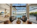 Relaxing pool and lanai area with outdoor seating at 1210 Blue Shell Loop, Sarasota, FL 34240