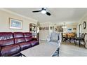 Open concept living and dining area with hardwood floors at 1737 Bonitas Cir # 1724D, Venice, FL 34293