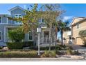 Two story home with gray siding and front porch at 322 Compass Point Dr # 201, Bradenton, FL 34209