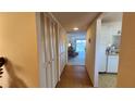 Hallway with built-in storage and view into living area at 514 Spring Lakes Blvd, Bradenton, FL 34210