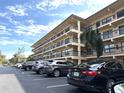 Condo building with parking and landscaping at 515 30Th W Ave # H207, Bradenton, FL 34205